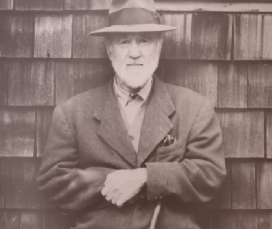 Charles Ives in front of his house